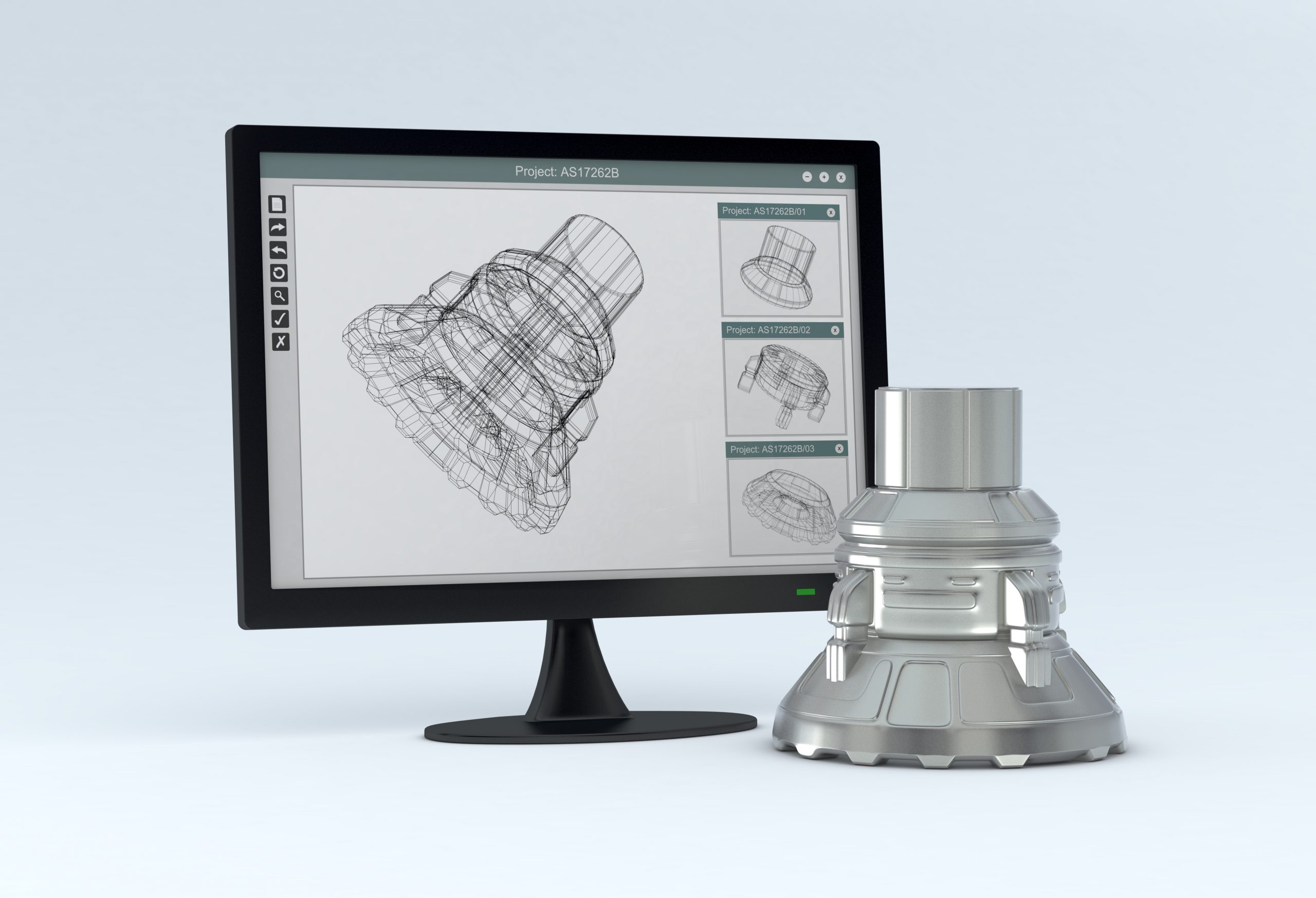 Computer monitor showing CAD software, with the finished product near it