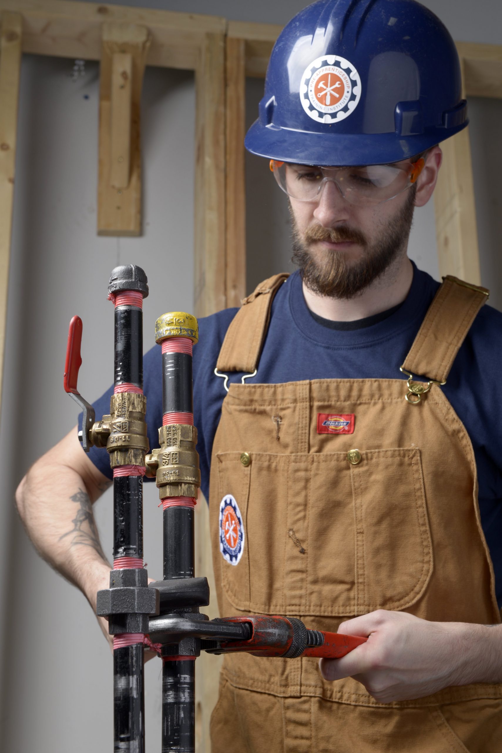 Gas technician student working on pipe