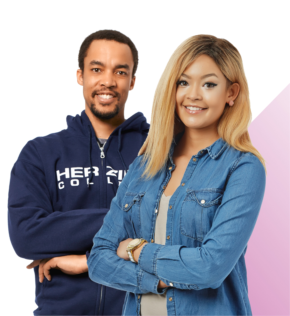 Male and female Herzing students smiling at camera