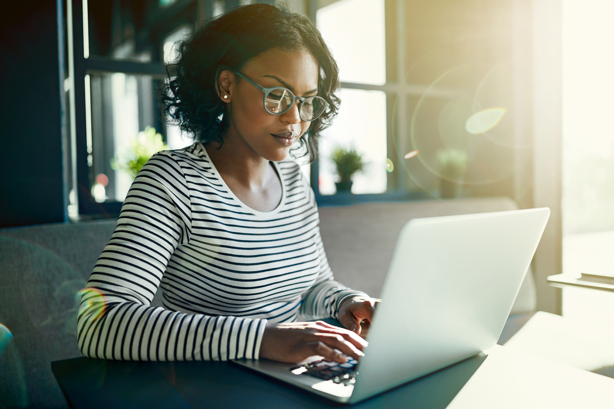 Young woman working online with a laptop