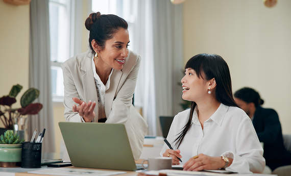 Two women in an office talking